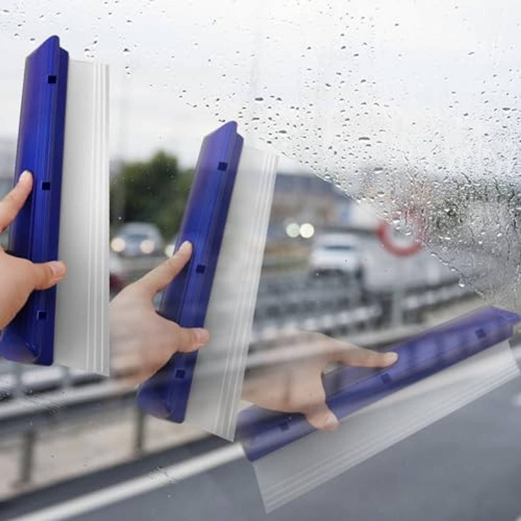 Blue car window squeegee blade held against glass with visible water droplets