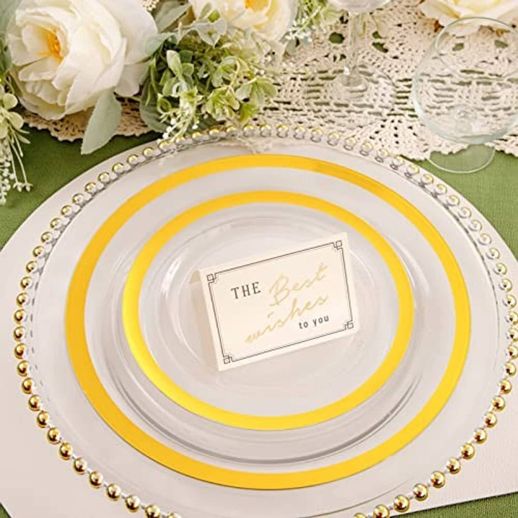Gold beaded border charger with white plate and yellow-gold concentric trim
