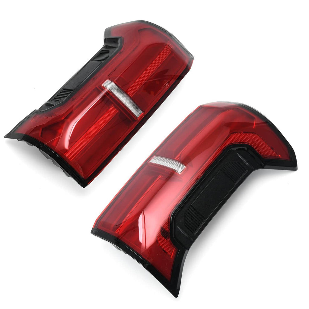 Angled view of two red rear LED tail lights with white reflector strip and black bezels