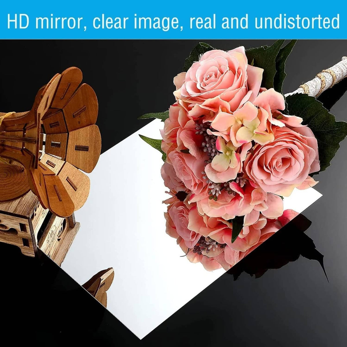 Acrylic mirror sheet showing crisp reflection of pink flowers