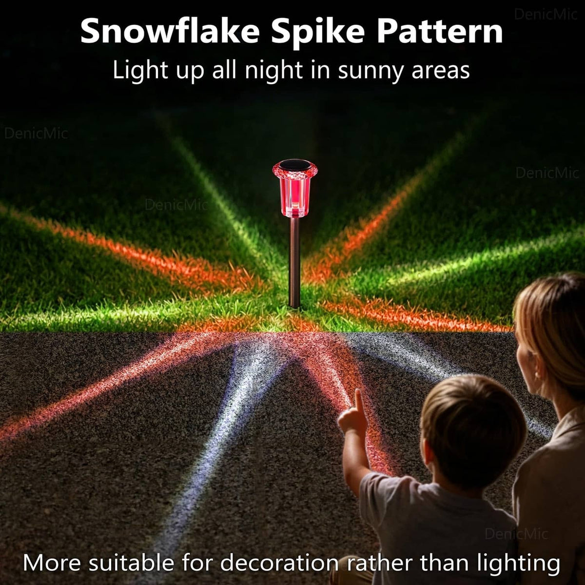 Single solar stake light with red glowing cap on a ground spike for outdoor decor