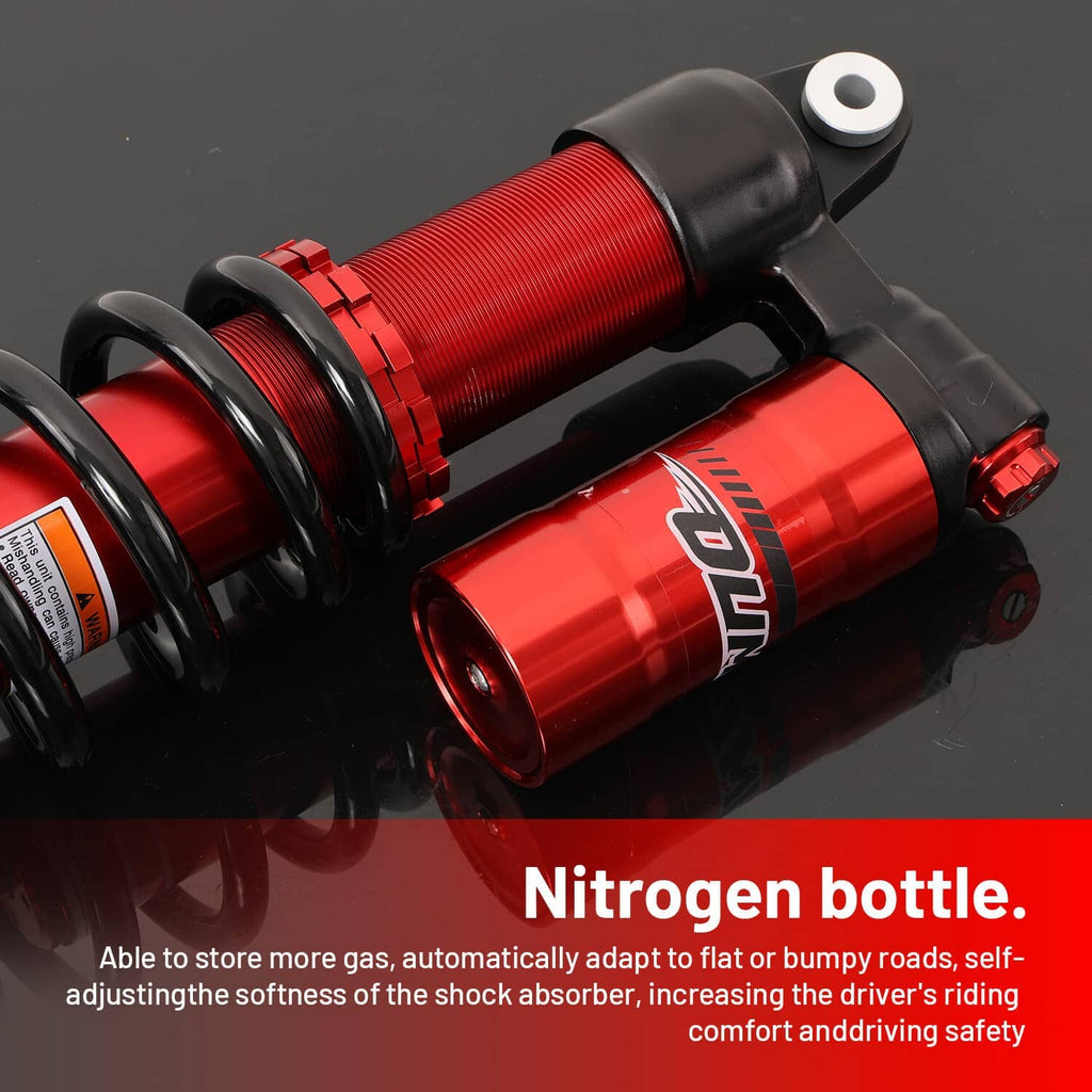 Close-up of red shock absorber with black reservoir body, coil spring, and top mounting bolt