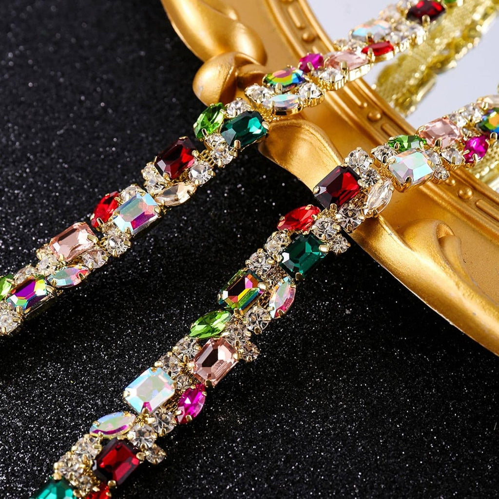 Close-up of gold rhinestone trim chain with multicolor AB crystals and faceted stones