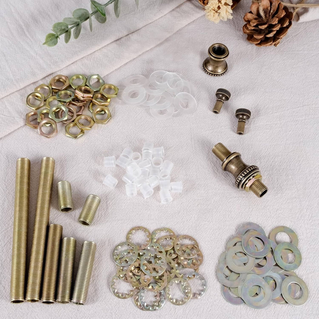 Lamp repair hardware assortment with brass rods, washers, and clear plastic cord stoppers