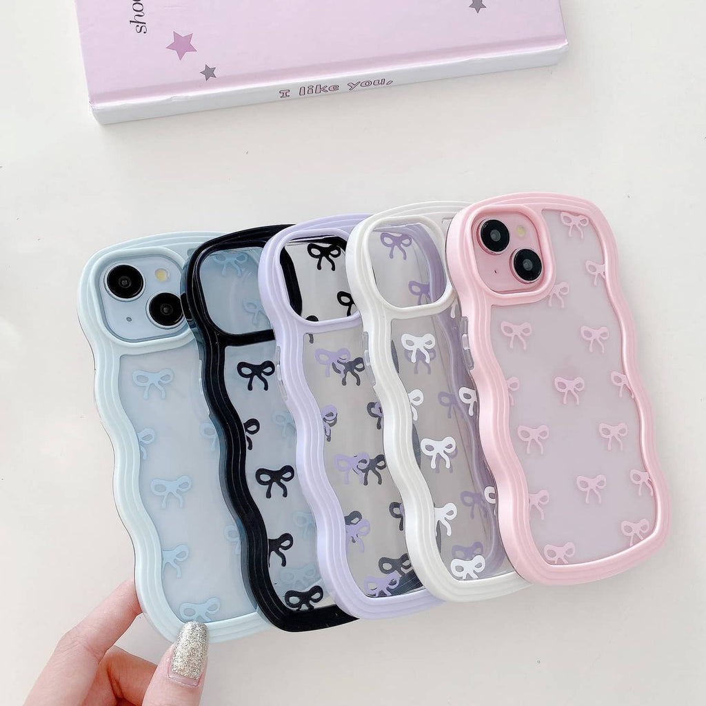Pink clear iPhone case with bow pattern displayed among other matching cases.