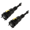 Front air suspension shock strut pair with black body, yellow caps, and front mounting plates