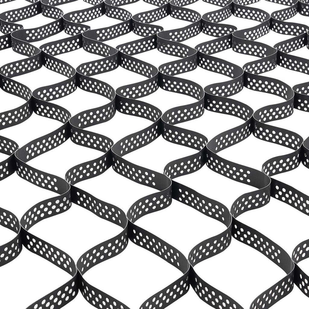 Close-up of black geocell grid with white dot holes, forming curved, interlocking cells