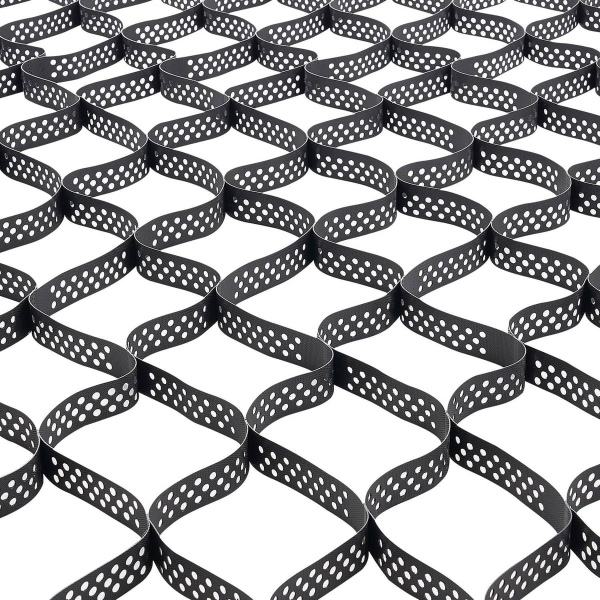 Close-up of black geocell grid with white dot holes, forming curved, interlocking cells