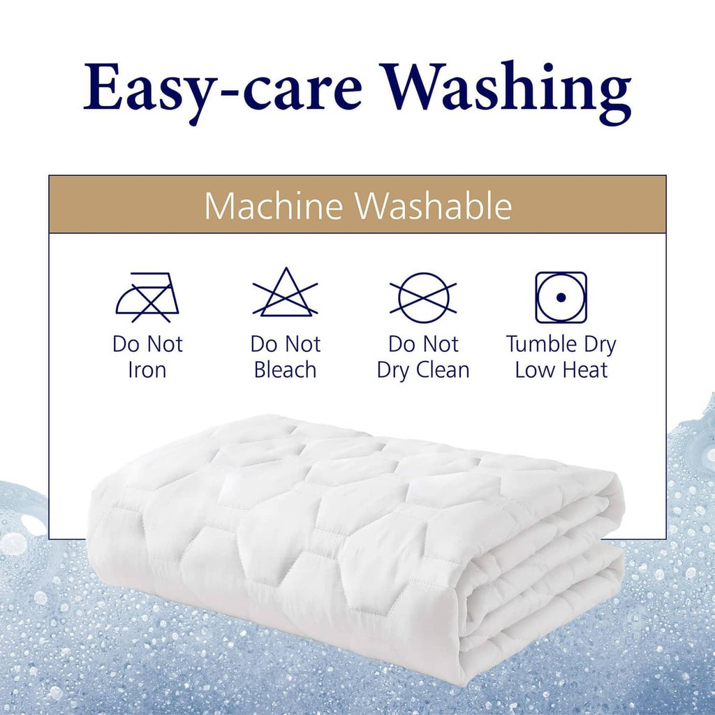 White quilted mattress pad protector, machine washable care icons shown