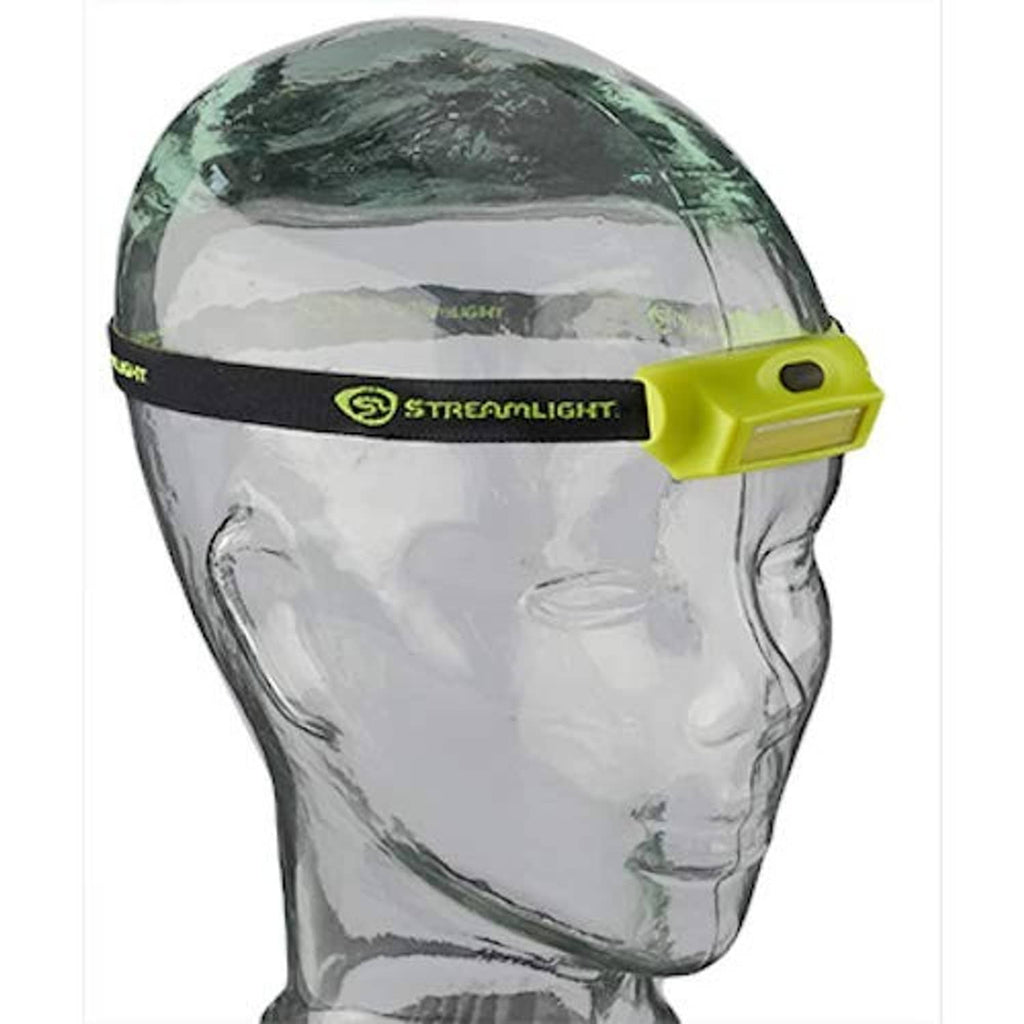 Headlamp with bright green module and black strap worn on mannequin head