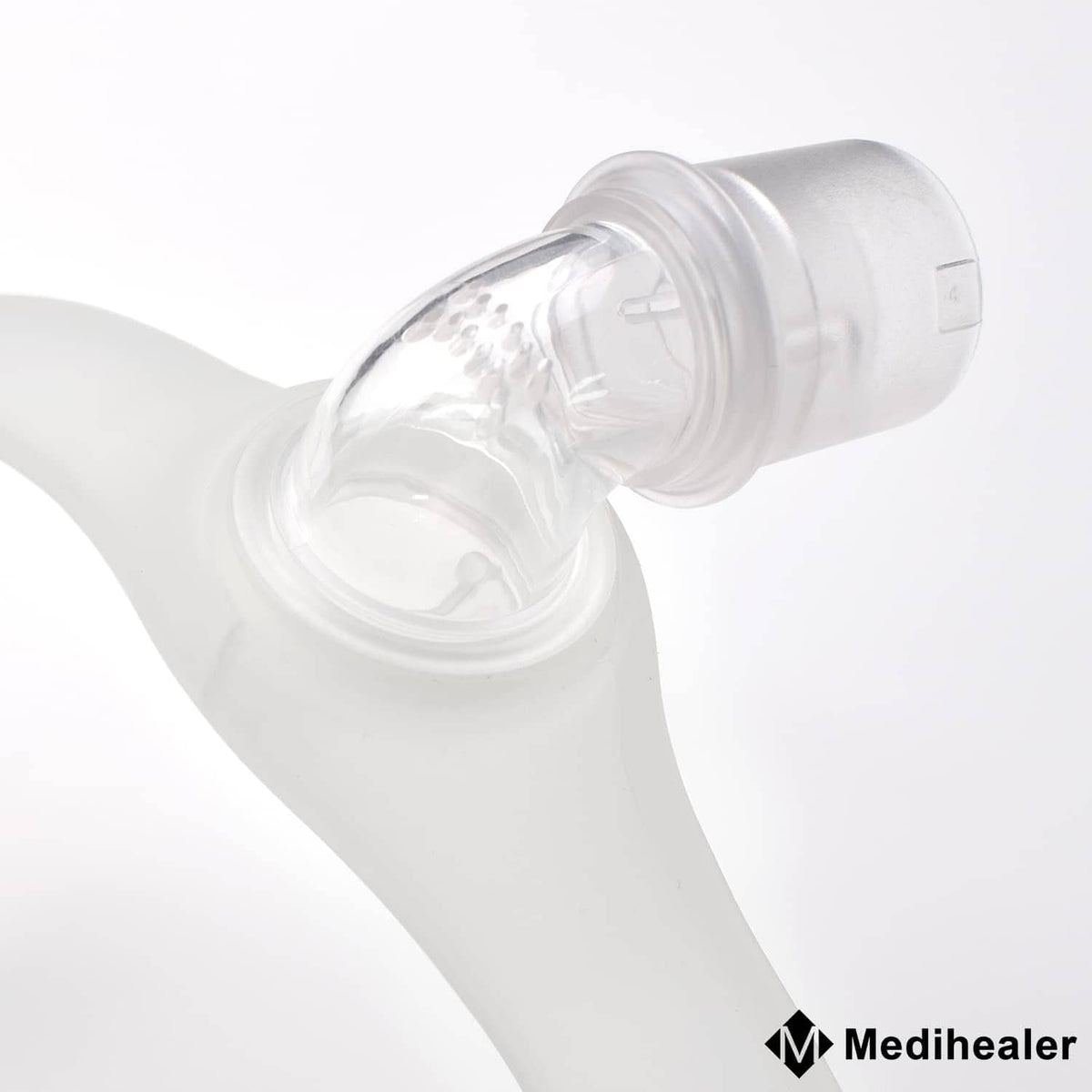 Clear elbow swivel connector attached to a mask interface tubing end