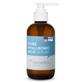 Hyaluronic acid serum bottle with white pump dispenser and amber glass