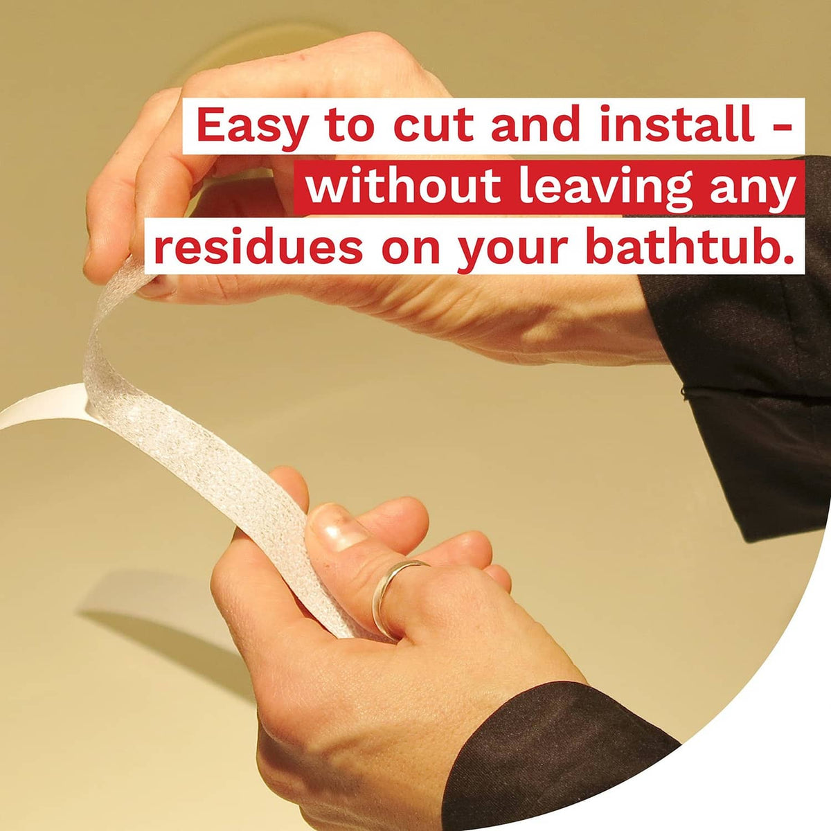 Clear textured anti-slip tape strip held by hands for bathtub application