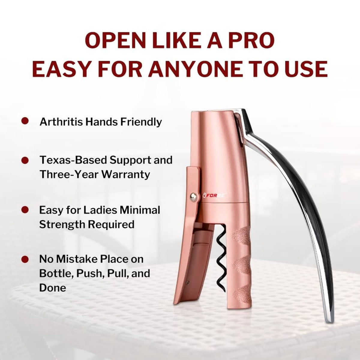 Pink vertical lever wine opener corkscrew with ergonomic handle and chrome foot.