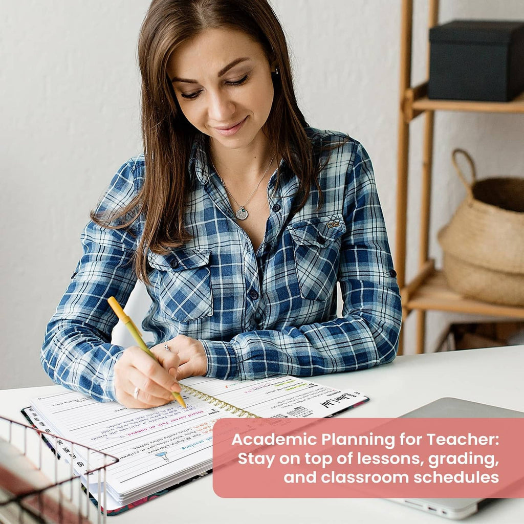 Teacher writing in spiral planner with schedule pages on desk