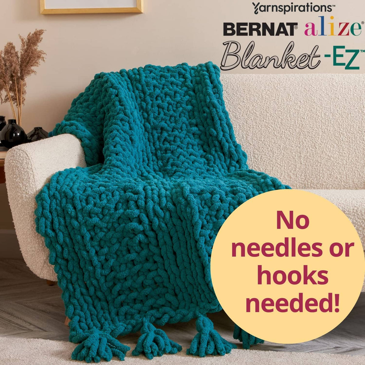 Teal Blanket-EZ loop yarn blanket draped over sofa with chunky textured stitches