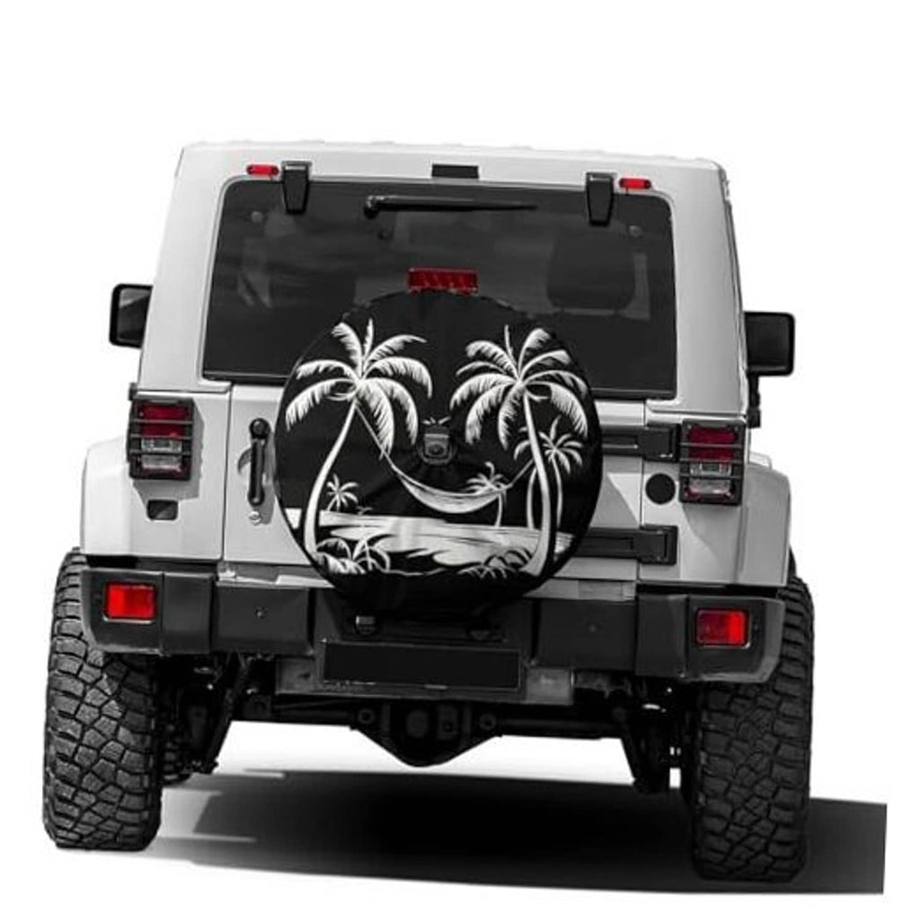 Black spare tire cover with white palm tree graphic and camera-hole opening