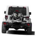 Black spare tire cover with white palm tree graphic and camera-hole opening