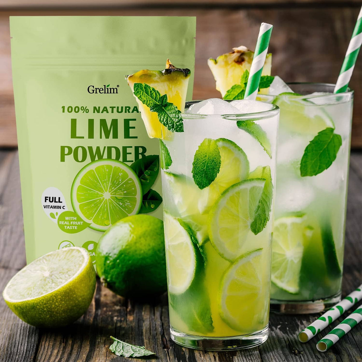 Lime powder pouch beside tall glasses of lime drink with lime slices and leaves