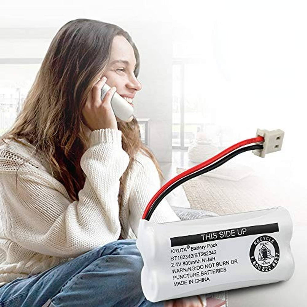 Cordless phone battery pack held by a person near a cordless phone handset
