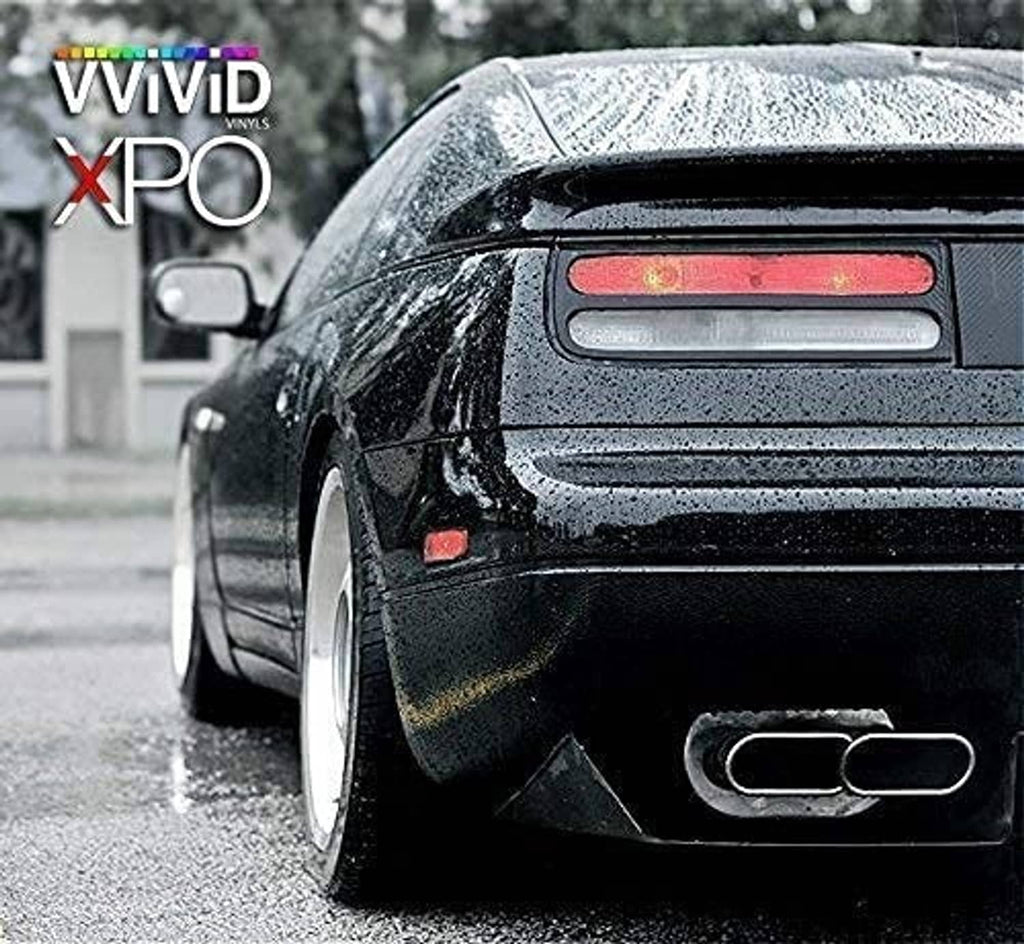 Black high-gloss vinyl-wrapped car rear corner panel, glossy realistic paint-like finish