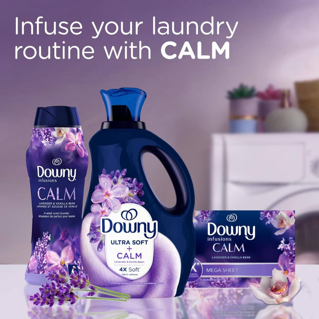 Downy Calm fabric softener bottles with lavender flowers and laundry sheets