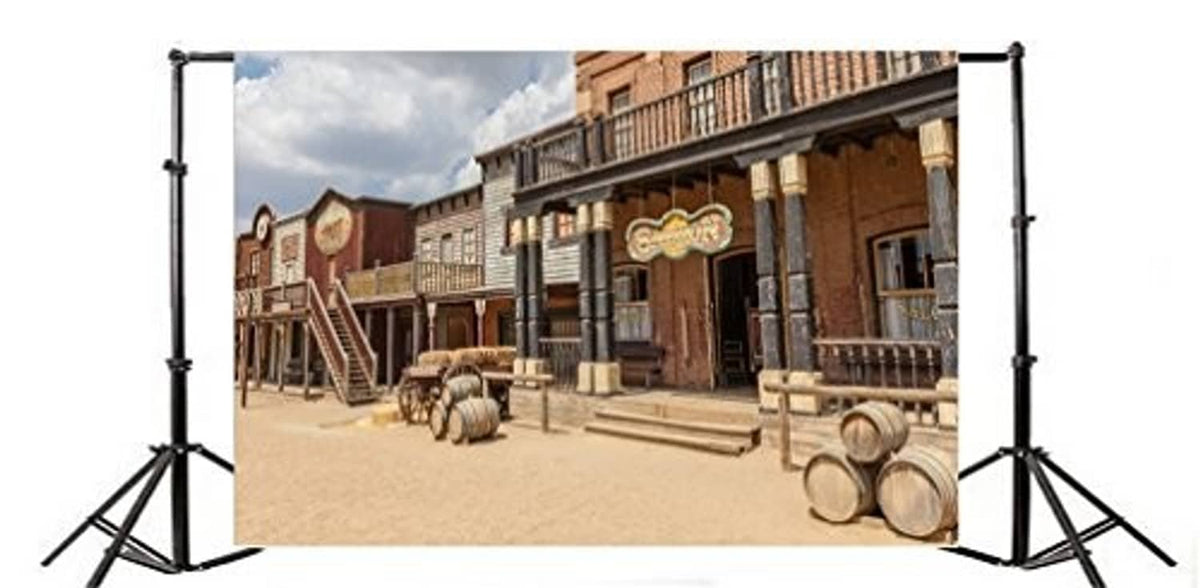 Western scenic backdrop with town buildings, barrels, and wooden steps