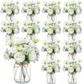 Set of 12 mason jar centerpieces with faux white roses and green foliage