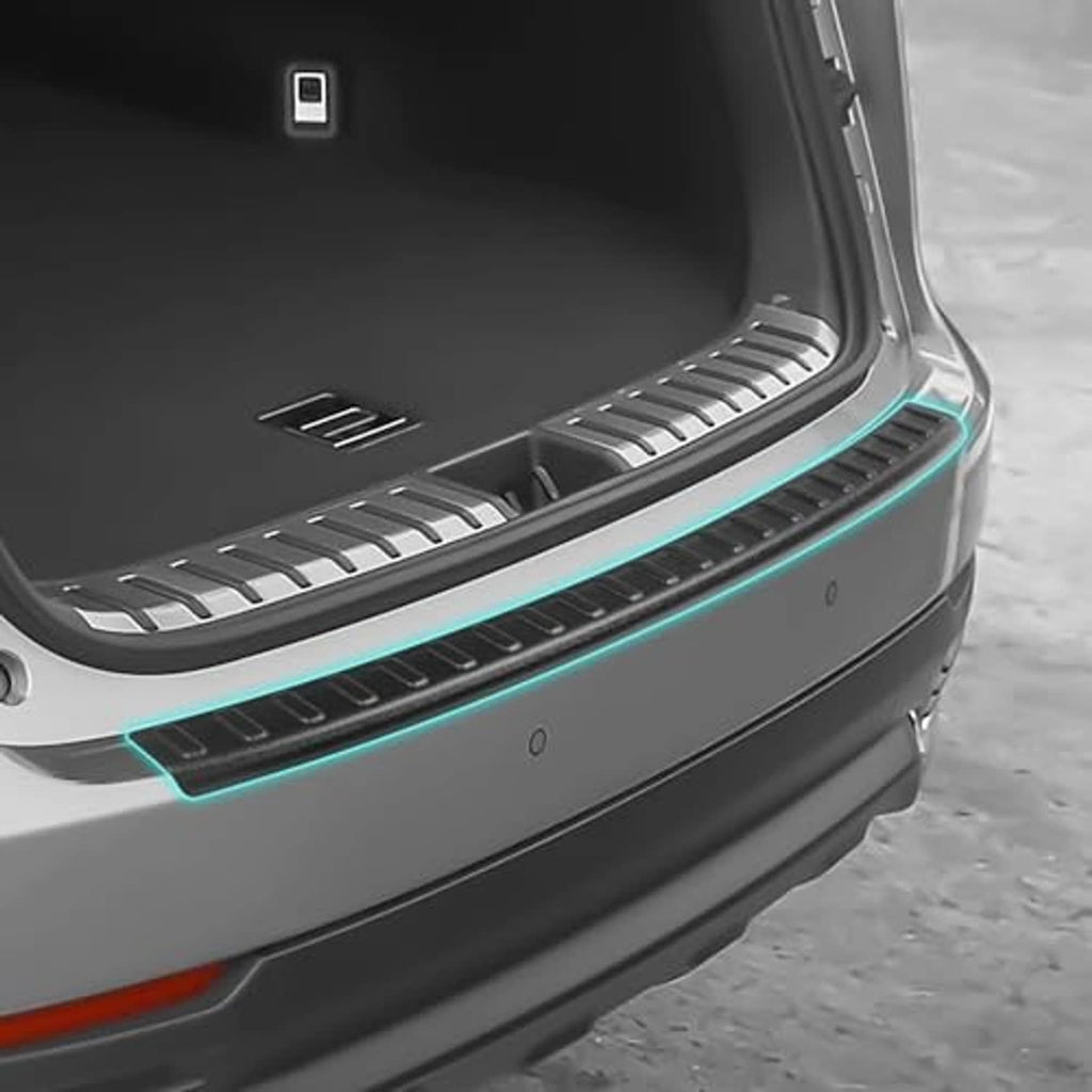 Matte black rear bumper protector strip with raised tread pattern, placed on rear bumper