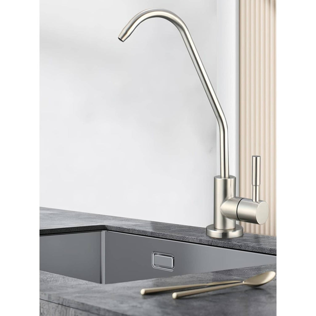 Brushed nickel water filter faucet mounted on sink deck with gooseneck spout