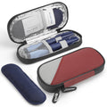 Red and gray insulin cooler case with foil-lined compartments and blue reusable packs, open