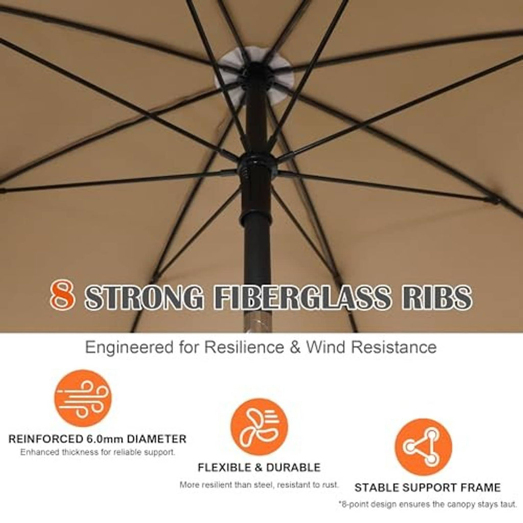 Tan umbrella canopy underside with black rib framework and center hub