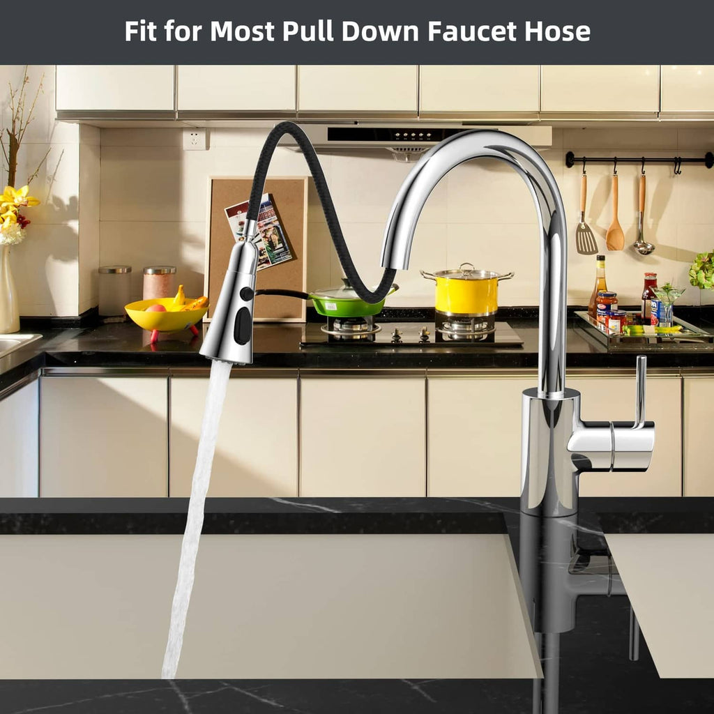 Chrome kitchen faucet sprayer head with water stream over a sink