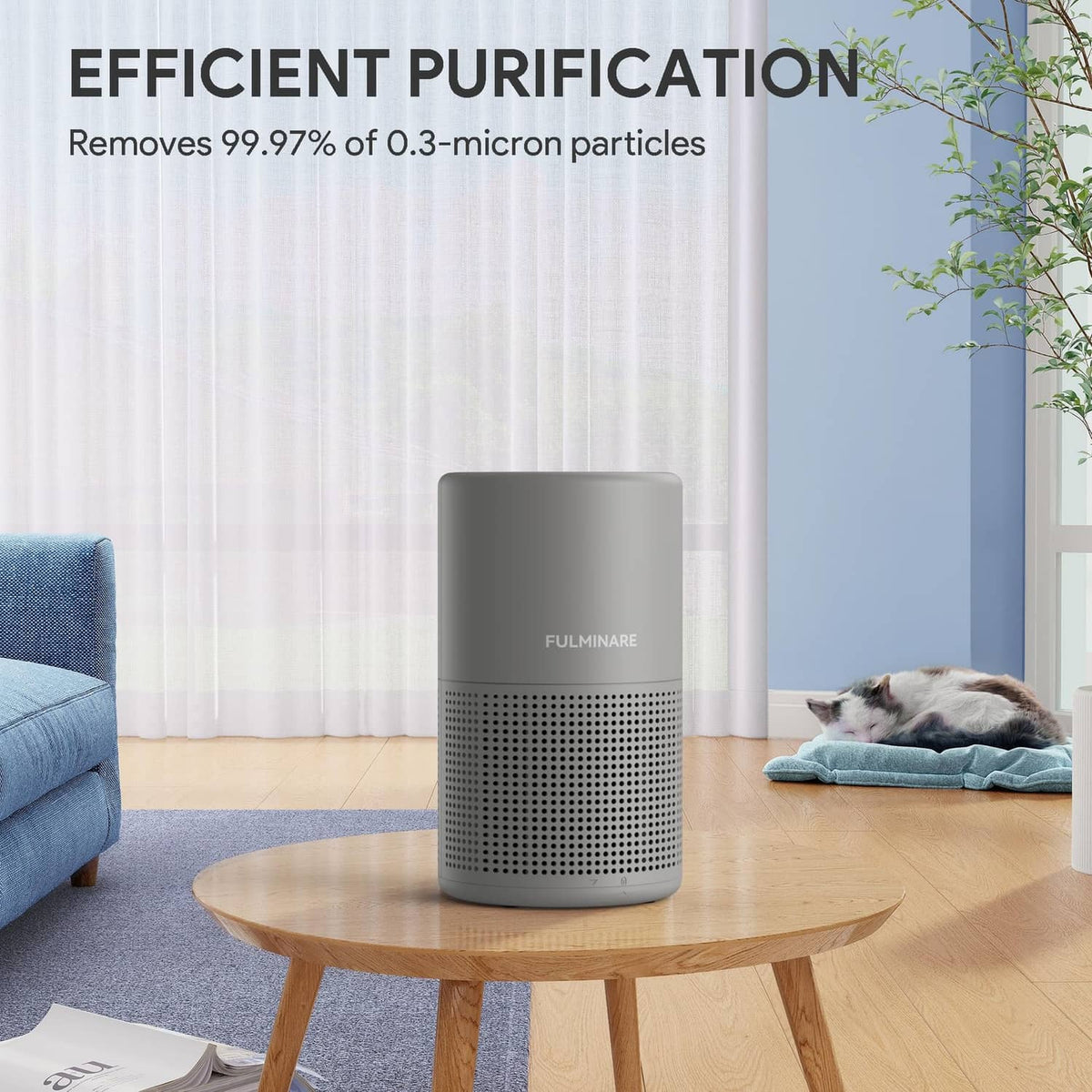 Gray FULMINARE air purifier on a round table, cylindrical body with vented front
