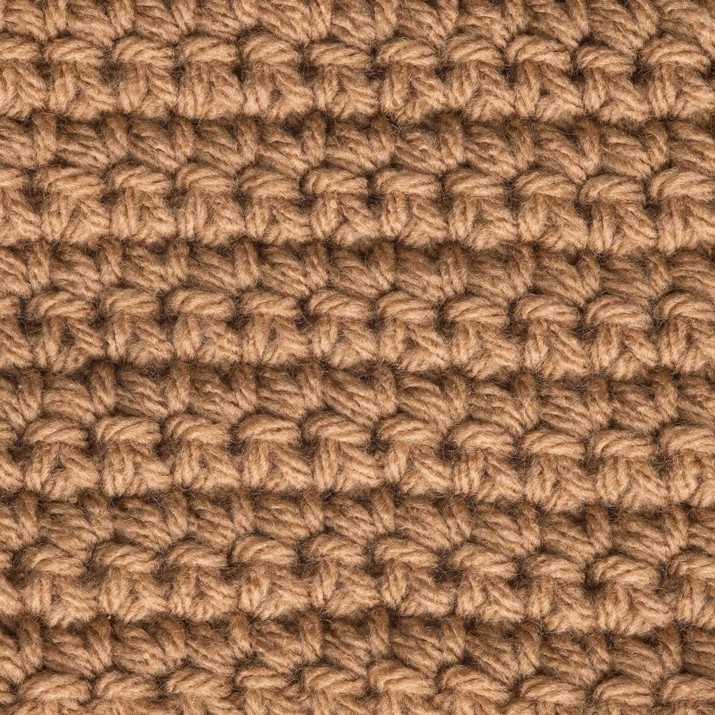 Worsted knit swatch with raised loops in tan and brown.