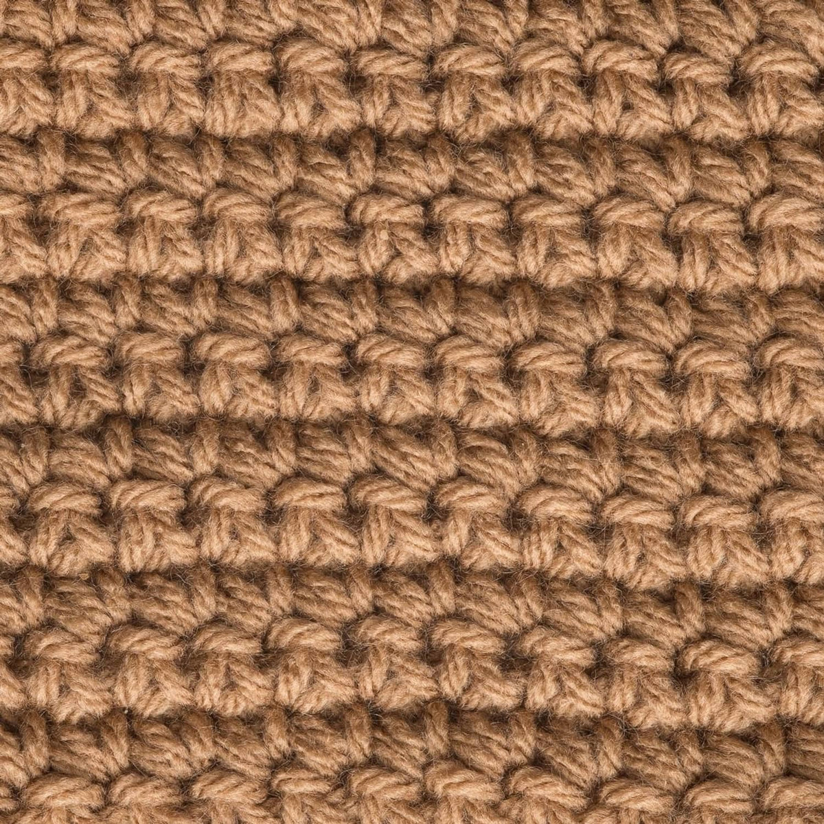 Worsted knit swatch with raised loops in tan and brown.