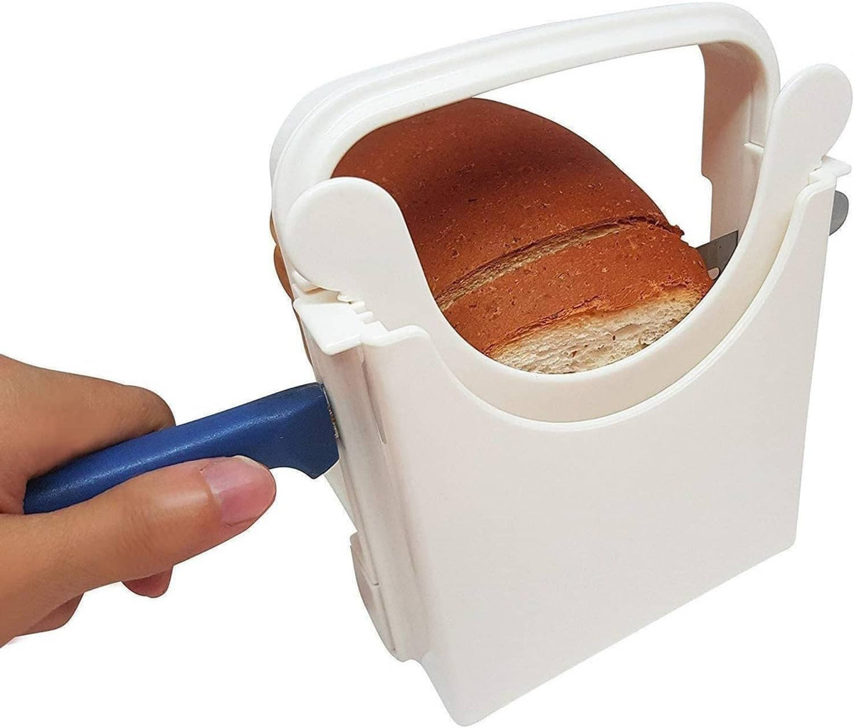 White foldable bread slicer guide with loaf loaded inside the side rails