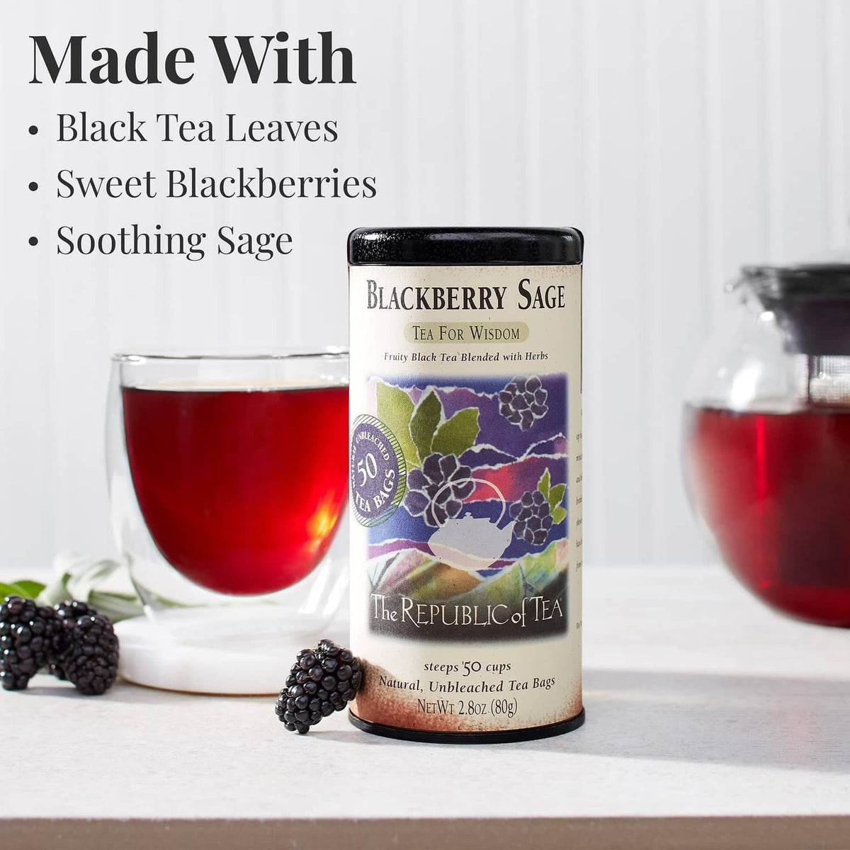 Blackberry Sage tea canister with glass of red tea and scattered blackberries