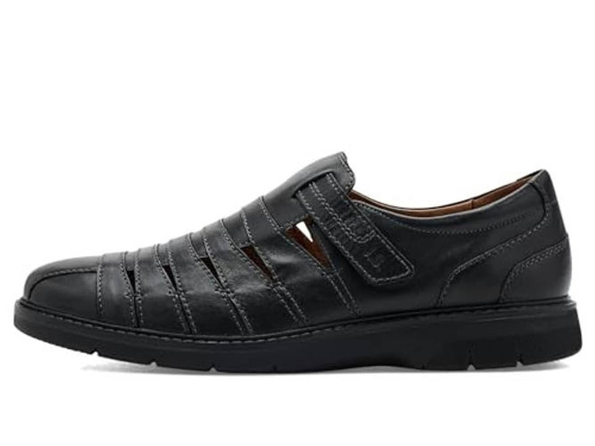 Black leather casual shoe with strap closure and side panel stitching