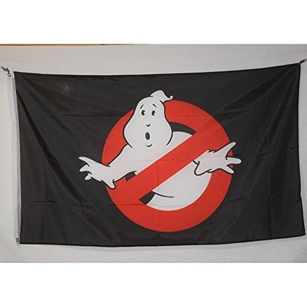 Ghostbusters flag banner on black fabric with large red-and-white ghost logo