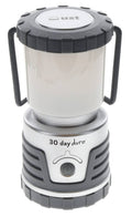Gray lantern with white translucent body, top carry handle, and front control dial