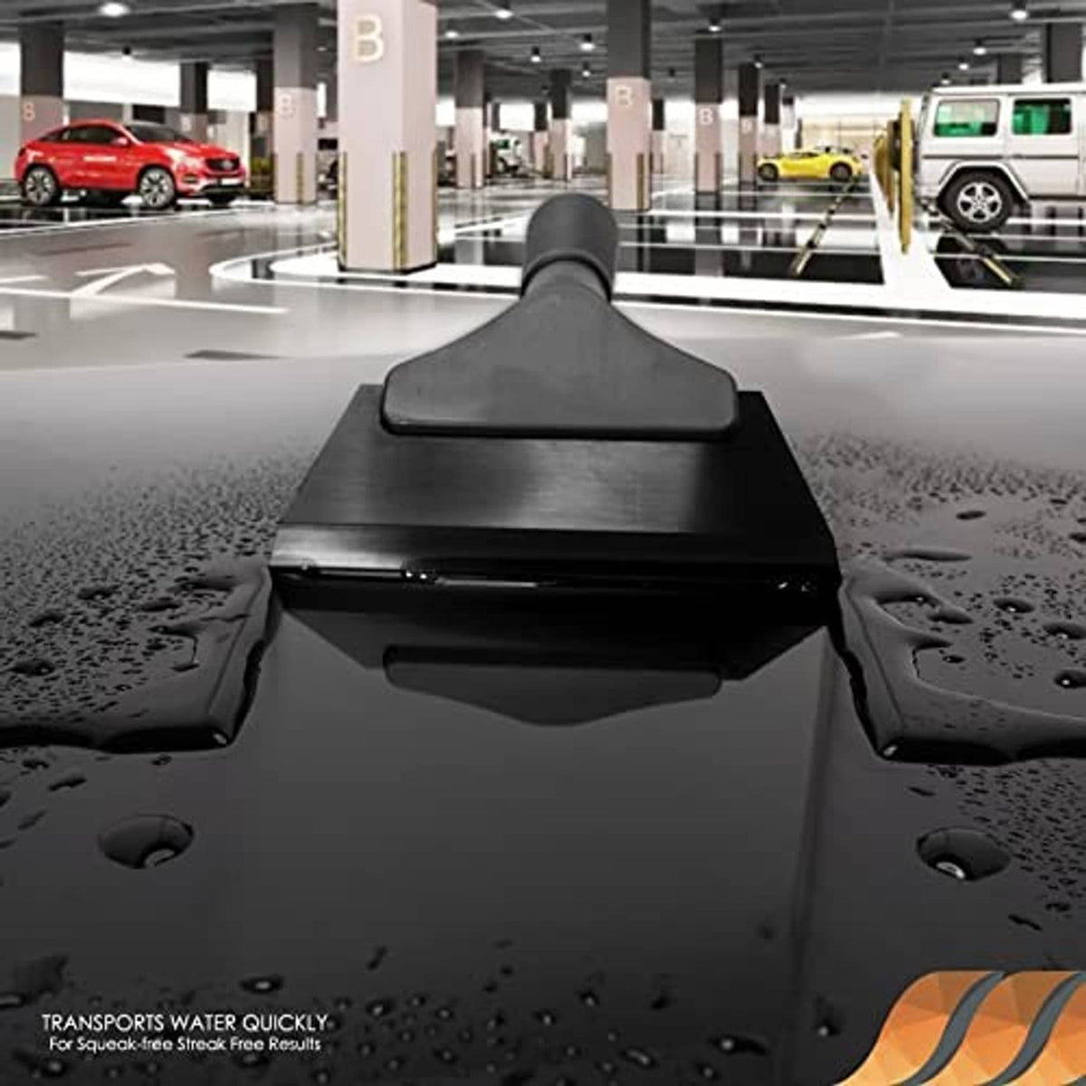 Black rubber squeegee pressed onto a wet car window glass surface