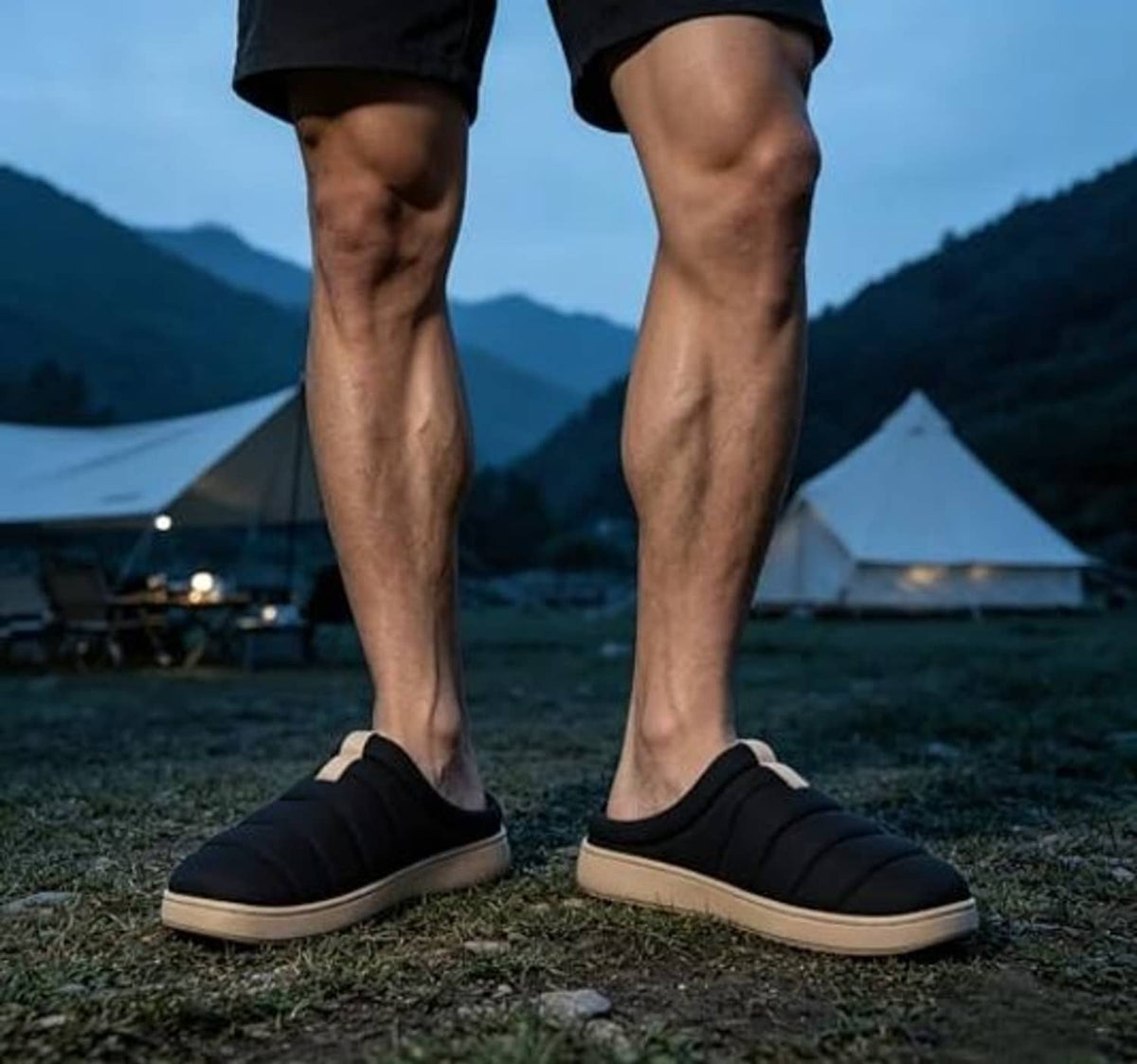 Men's black slide slippers with cushioned memory-foam insole and low-profile sole.