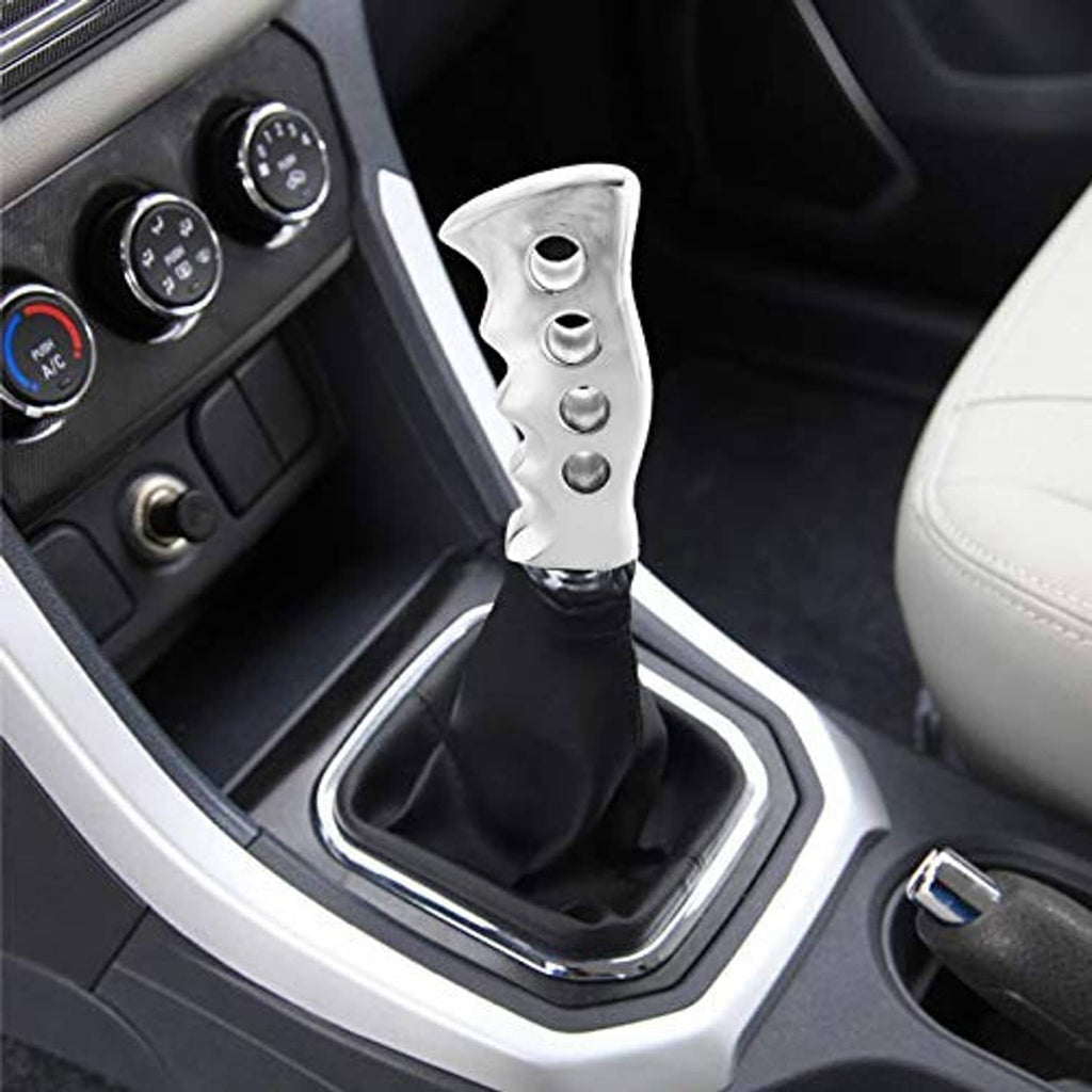 Silver gear shift knob installed in car with black shift boot and textured grip