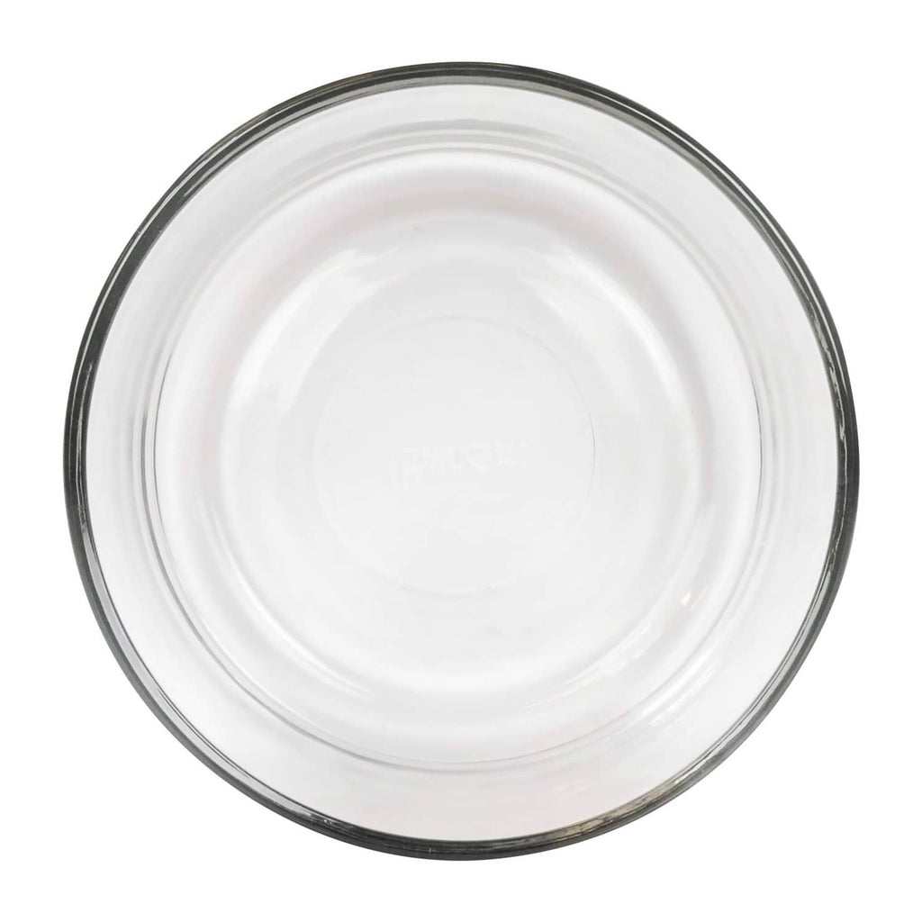 Pyrex clear 4-cup glass bowl top view, embossed base and dark edge rim