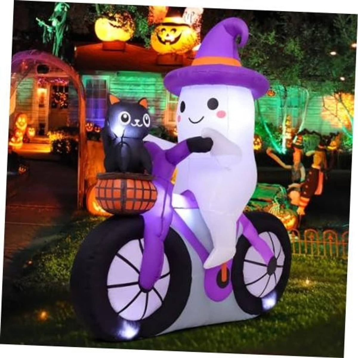 Purple and white inflatable ghost on black bicycle with smiling cat beside pumpkin basket