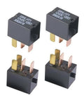 Four black 4-pin car fan relays with brass and pink blade terminals