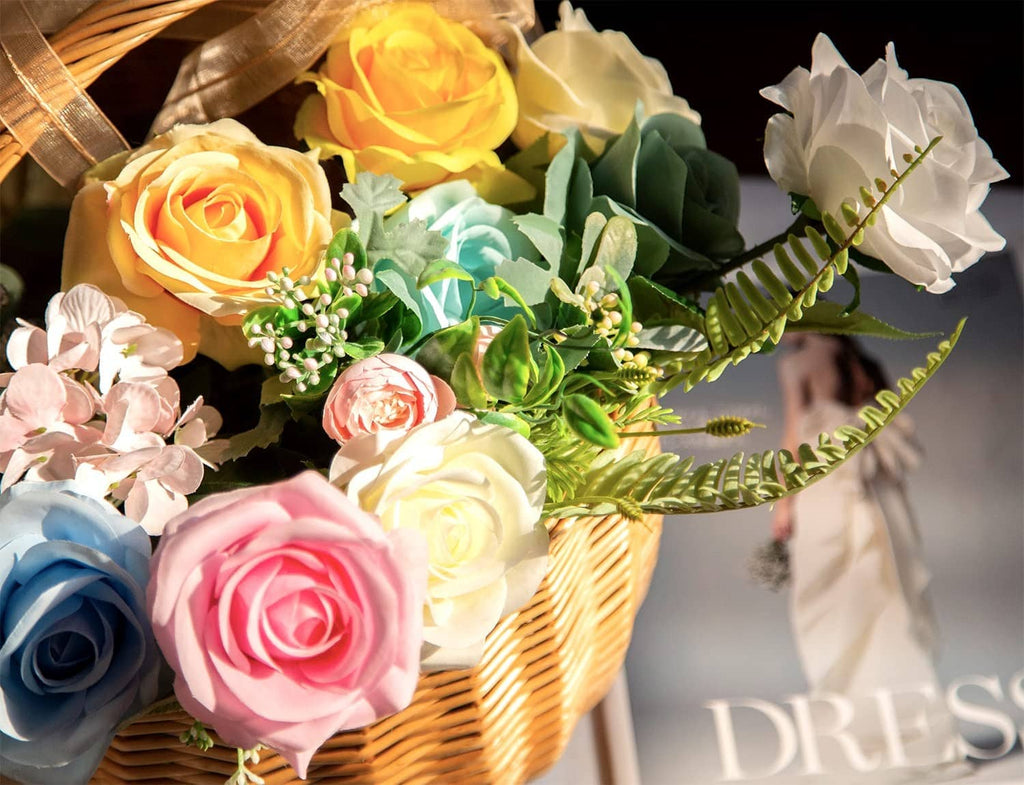 Wicker basket with artificial roses in teal blue, white, pink, and yellow tones