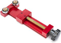 Red oil filter cutter tool with threaded rod, two roller bearings, and black adjustment knob