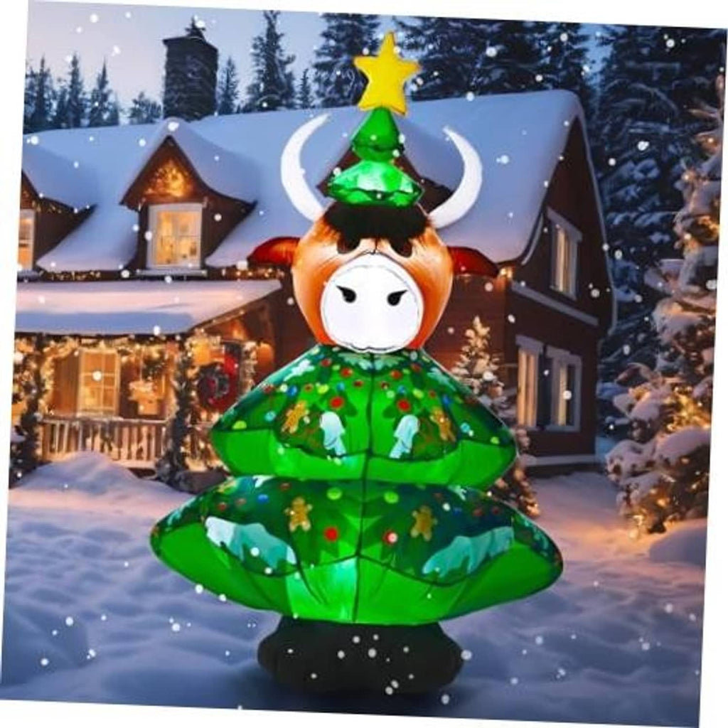 Inflatable highland cow figure in green Christmas tree dress with white horns and star topper